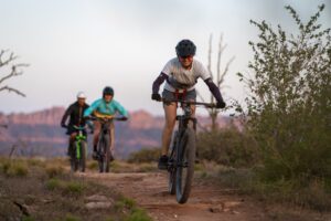 Mountain biker charging desert singletrack near Virgin, Utah - Zion's Tiny Getaway